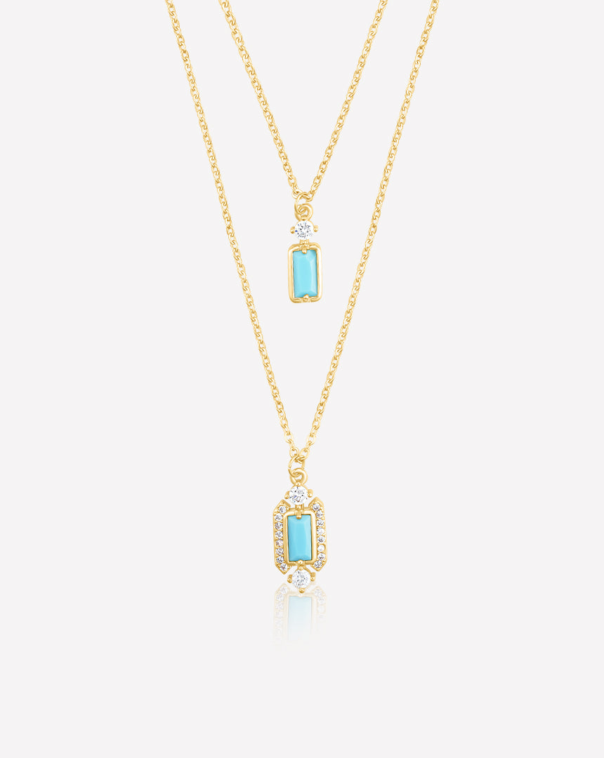 18K yellow gold-plated two-layered necklace featuring an emerald-shaped turquoise stone with pure zircon accents