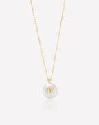 Yellow gold plated letter necklace with a freshwater cultured pearl from the Perla Collection, featuring an elegant and unique design