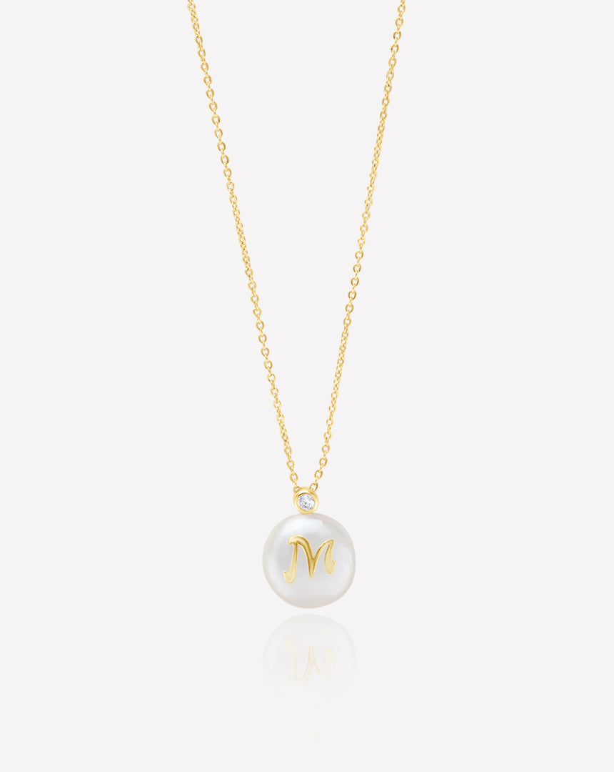 Yellow gold plated letter necklace with a freshwater cultured pearl from the Perla Collection, featuring an elegant and unique design